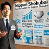 A professional setting where a Japanese individual is explaining their motivation for joining Nippon Shokubai. The background showcases absorbent polymers for diapers and functional chemical materials with the word 'Shokubai' prominently displayed. The atmosphere is aspirational and positive.